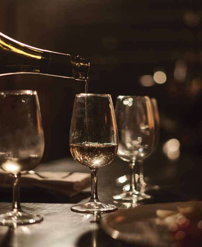 Wine being poured at the residents' bar